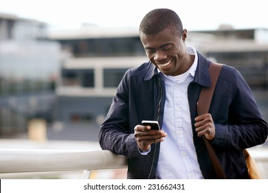 Happy Young Black African Man With Cell Phone Having Conversation On Mobile