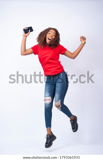 Happy Young Black Lady Jumping Excitement Stockfoto 1793361931