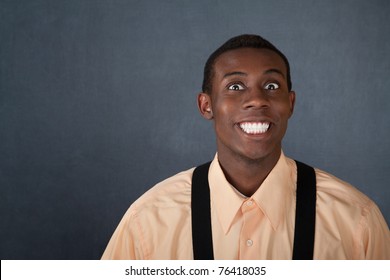 Happy Young Black Man On Gray Background With Big Grin