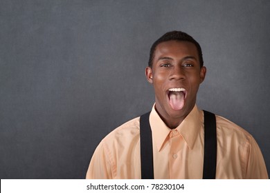 Happy Young Black Man Sticks Out His Tongue