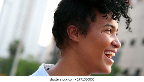 Happy Young Black Woman Spontaneous Smile And Laugh. Person With Positive Attitude