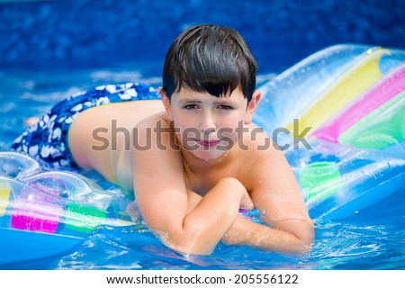 Similar – photo of an adorable boy learning to swim