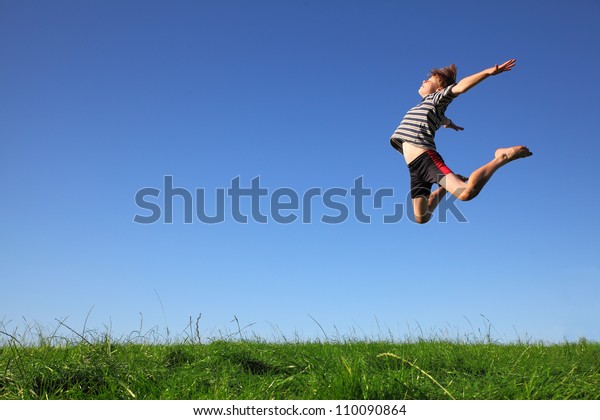 Happy Young Boy Jumping Meadow Stock Photo (Edit Now) 110090864