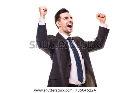 Happy young business man celebrating success shouting upwards, over white background