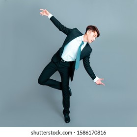 Happy young business man dancing in motion - Shutterstock ID 1586170816