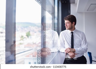 Happy Young Business  Man Work In Modern Office On Computer