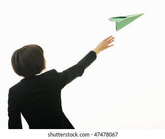 Happy Young Business Woman Isolated On White Throwing Paper Airplane