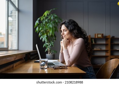 Happy Young Business Woman, Writer Or Designer Entrepreneur Use Computer Look At Screen Smiling Read Email With Positive Feedback From Client. Cheerful Female Working In Internet Sit At Office Desk