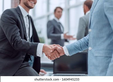 Happy Young Businessman Shaking Hands With His Business Partner