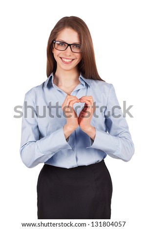 Happy young businesswoman put her hands in the form of heart