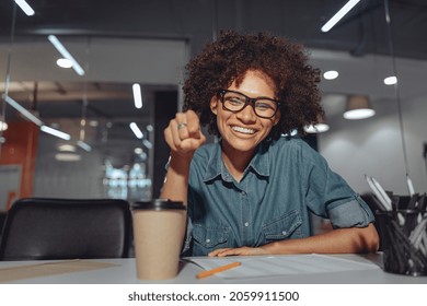 Happy Young Businesswoman Working In The Office And Showing Sign Language