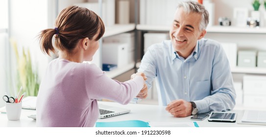 Happy Young Candidate Shaking Hands With Her Employer After A Job Interview, Employment And Business Meetings Concept