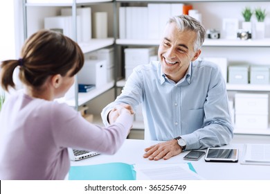 Happy Young Candidate Shaking Hands With Her Employer After A Job Interview, Employment And Business Meetings Concept