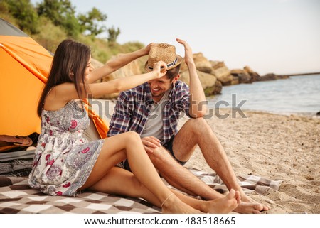 Similar – Image, Stock Photo pair of female beach slippers and a pink towel