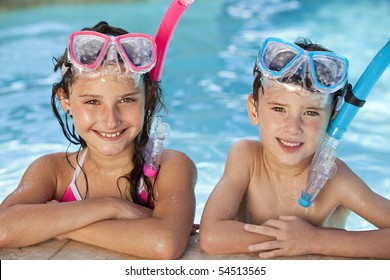 Happy young children, boy and girl, relaxing on the side of a swimming pool wearing blue and pink goggles and snorkel - Powered by Shutterstock