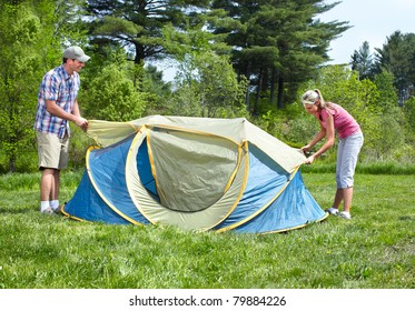 Happy Young Couple With Big Tent. Camping.