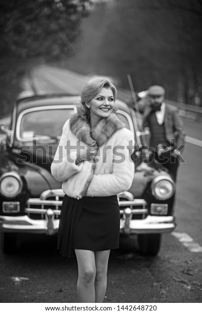 Happy young couple at a car. Travel and adventure\
concept. Toned picture