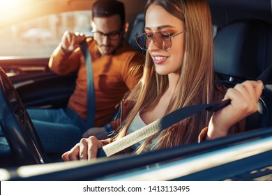 Happy Young Couple In The Car,enjoying Together.