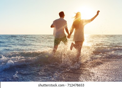 Happy young couple enjoying the sea - Powered by Shutterstock