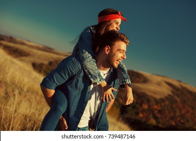 Happy young couple enjoys a sunny day in nature - Shutterstock ID 739487146