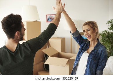 Happy And Young Couple Giving High Five 
