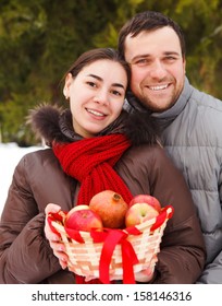 Happy Young Couple Having Fun In The Winter Park 