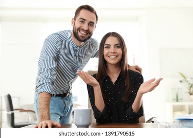 Happy Young Couple Looking At Camera And Using Video Chat In Home Office