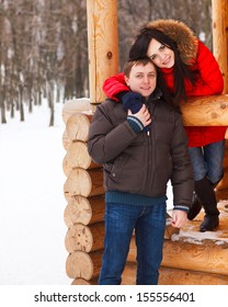 Happy Young Couple In Love Having Fun In The Winter Park