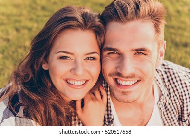 Happy Young Couple In Love Smiling.