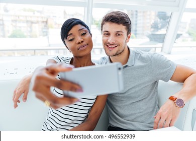 Happy young couple making selfie photo in restaurant స్టాక్ ఫోటో