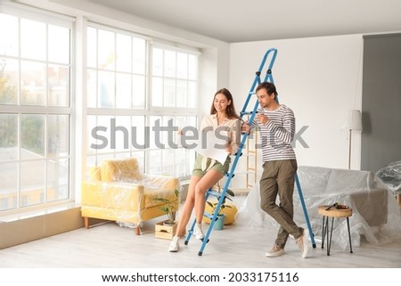 Happy young couple planning repair in their new house Foto stock © 