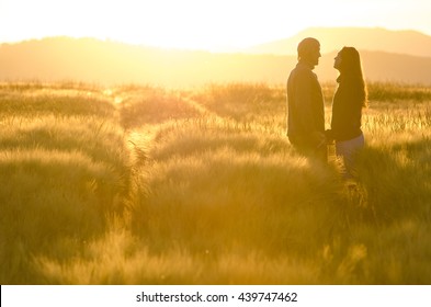 happy young couple in romance and fun wheat field in summer beautiful landscape couple in wheat field. - Powered by Shutterstock