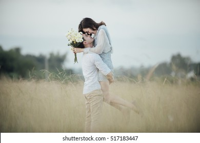 Happy Young Couple In Romance On Summer Beautiful Landscape