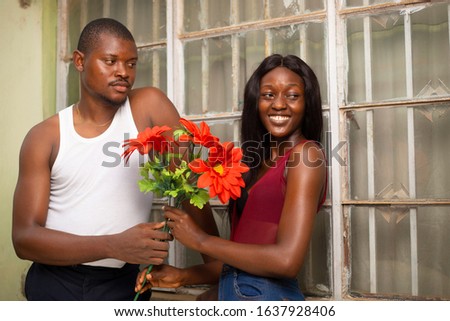 a happy young couple show affection for valentine outdoor