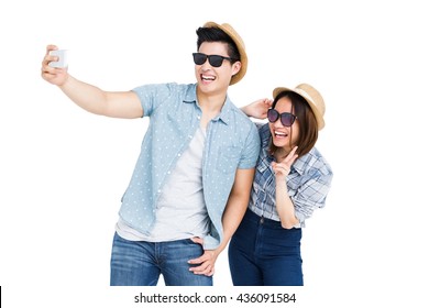 Happy Young Couple Taking A Selfie On White Background