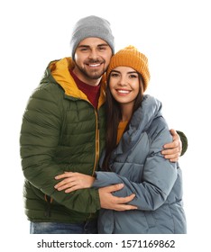 Happy Young Couple In Warm Clothes On White Background. Winter Vacation