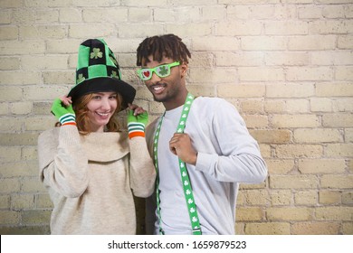 Happy Young Couple Wearing Costumes to Celebrate St. Patrick's Day. - Powered by Shutterstock