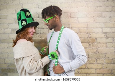 Happy Young Couple Wearing Costumes to Celebrate St. Patrick's Day. - Powered by Shutterstock