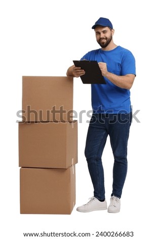 Happy young courier with stack of parcels and clipboard on white background
