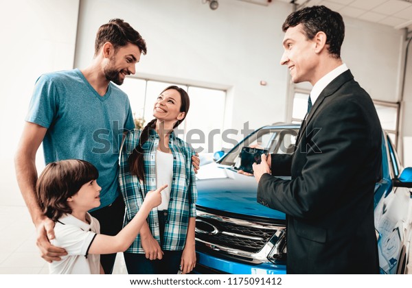 Happy Young Family Choosing New Car Stock Photo Edit Now