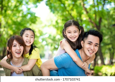 Happy Young Family Having Fun Outdoors