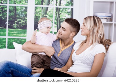 The Happy Young Family Inside The Flat