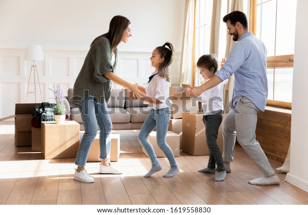 Happy Young Family Little Kids Dance Stock Photo (Edit Now) 1619558830