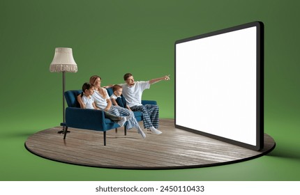 Happy young family in pajamas, man, woman and children sitting on sofa and looking at giant 3D model of tablet with empty screen. Watching TV. Concept of business, Internet services - Powered by Shutterstock