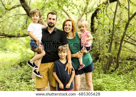 A Happy young family spending time outdoor on a summer day