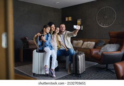 Happy Young Family With Two Children Taking Selfie At Luxury Hotel, Summer Holiday.