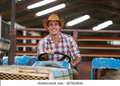 Happy Young Farmer Driving Tractor