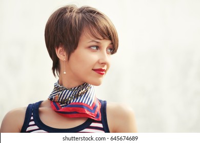 Happy Young Fashion Woman With Pixie Hair Walking On City Street Stylish Female Model In Tank Top And Silk Scarf