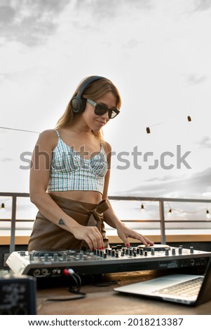 Similar – woman sitting with mixing table, in the terrace