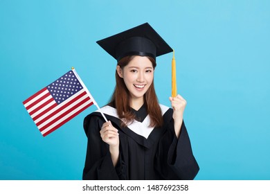 Happy Young Female Graduation Student Showing The USA Flag